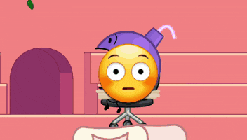 a cartoon smiley face is tied up in a chair with a purple helmet on