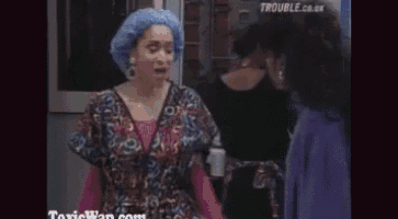 a woman wearing a surgical cap talks to another woman in a room .