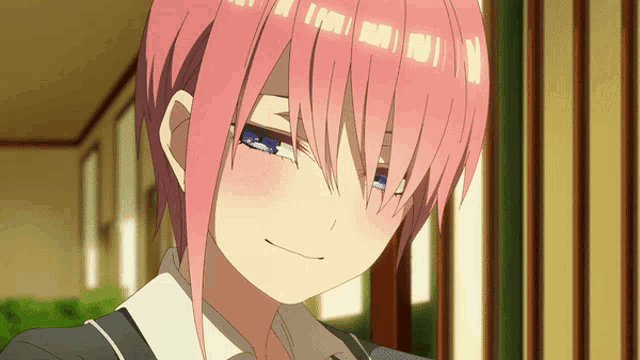 a girl with pink hair and blue eyes is making a face