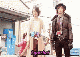 a man and a woman are standing next to each other and the woman says " i gotcha "