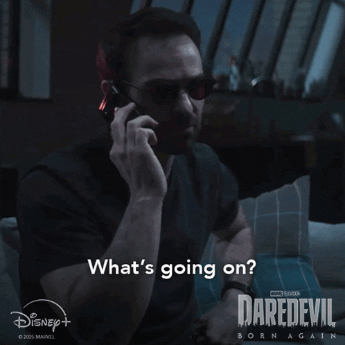 a man talking on a cell phone with the words what 's going on