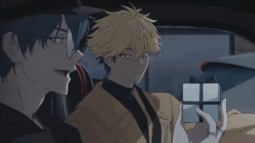 two anime characters are sitting in a car one is holding a gift box