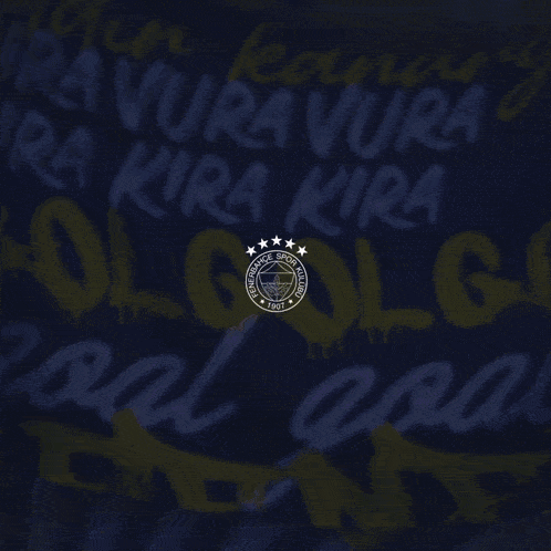 a man in a yellow and blue otokoc shirt