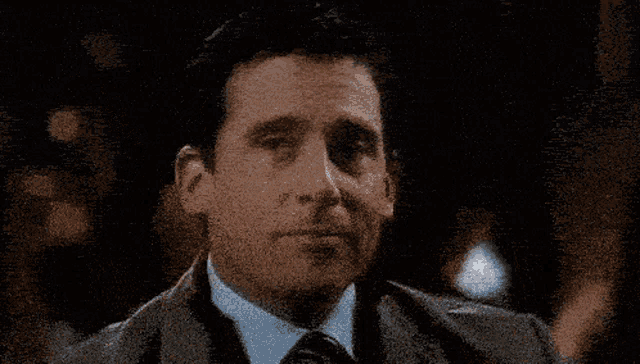 a man in a suit says thats dababyable in a pixelated image