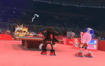 shadow the hedgehog is playing ping pong in a tokyo 2020 stadium