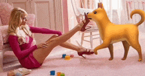 a woman in a pink dress is sitting on the floor with her legs crossed while a dog sniffs her heels