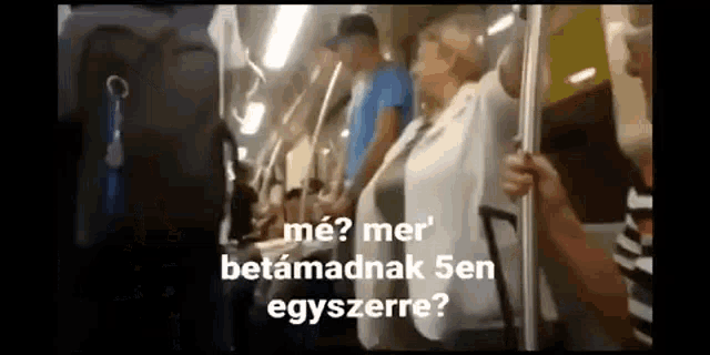 a group of people sitting on a train with the words me ? mer betamadnak 5en egyszerre written above them