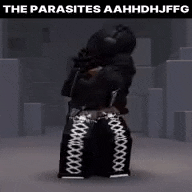 a person in a black outfit is standing in a dark room with a gun in their hand .