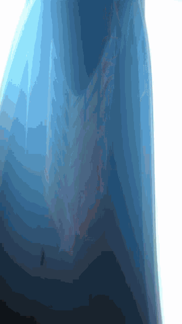 a close up of a blue object with a white border