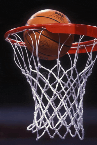 an nba basketball is going through a net