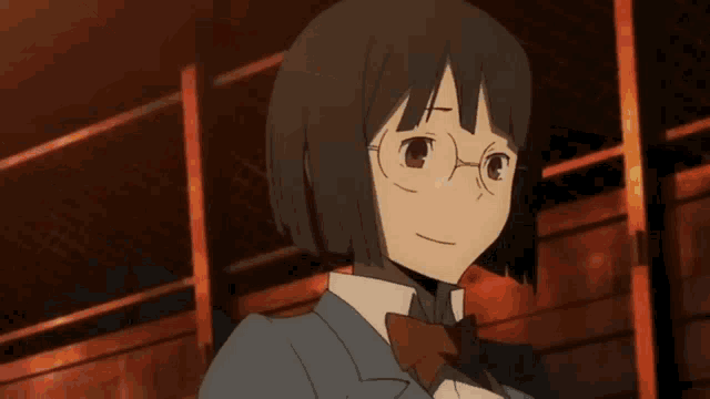a girl wearing glasses and a bow tie