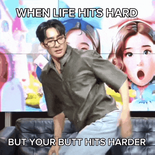 a man is sitting on a couch with a caption that says " when life hits hard but your butt hits harder "