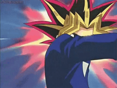 a cartoon character with a crown on his head is standing in front of a pink and blue background .