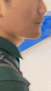 a man 's face is shown in a blurry photo