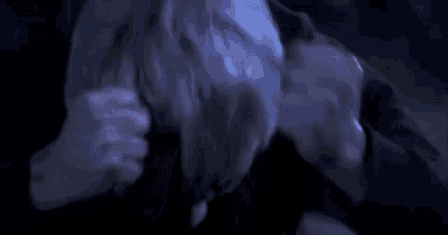 a close up of a person 's head with a blue light coming out of it .