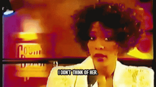 a woman is talking into a microphone and says " i don 't think of her "