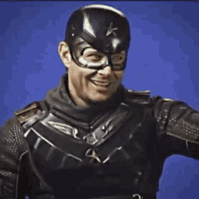 a man in a captain america costume is making a funny face .