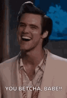 a man in a suit is laughing and saying `` you betcha , babe '' .