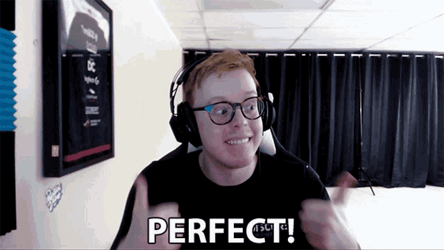 a man wearing headphones and glasses says " perfect "