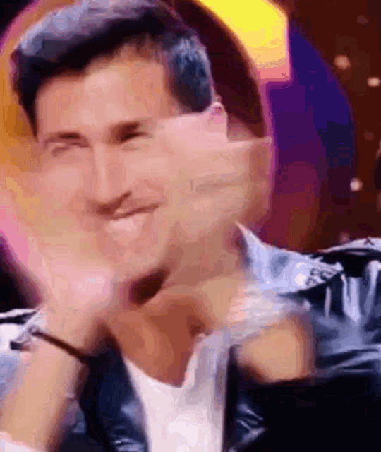 a blurry picture of a man making a face