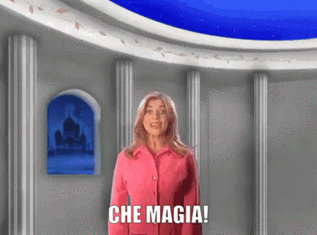 a woman in a pink jacket says che magia in front of a castle