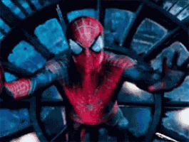 a close up of a spider man standing in front of a spider web