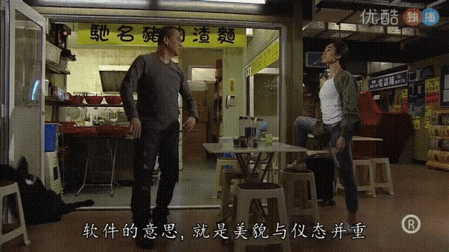 two men are standing in front of a store with chinese writing on it