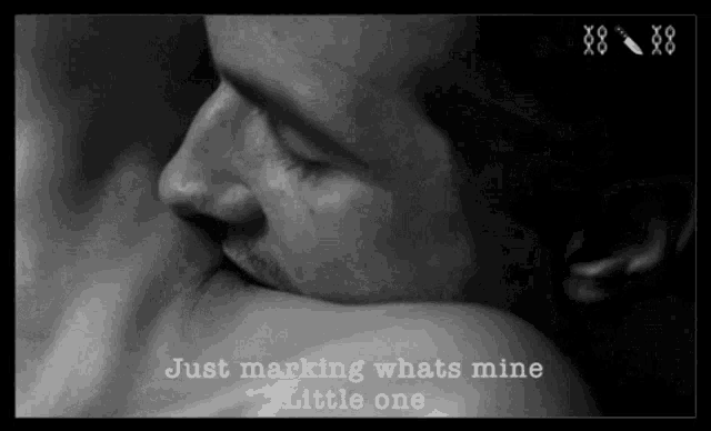 a black and white photo of a man kissing a woman with the words just marking whats mine little one