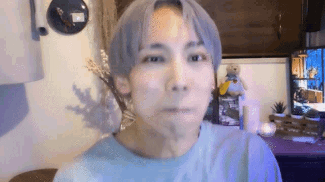 a man with gray hair is making a funny face