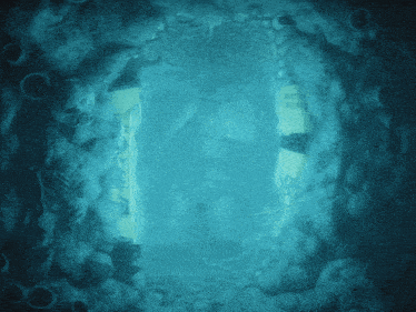 a tunnel in the water with a sign that says ' water ' on it