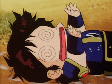 a cartoon character laying on the ground with a swirl around his eyes