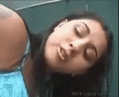 a close up of a woman 's face with the website mfxvideo.com in the background