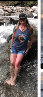 a woman in a maui shirt is standing in the water