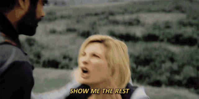 a man is holding a woman in his arms and says " show me the rest "