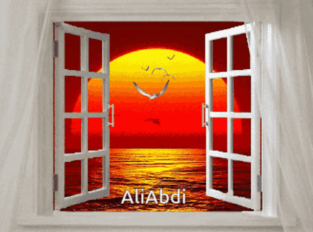 an open window with a picture of a sunset and the name aliabdi