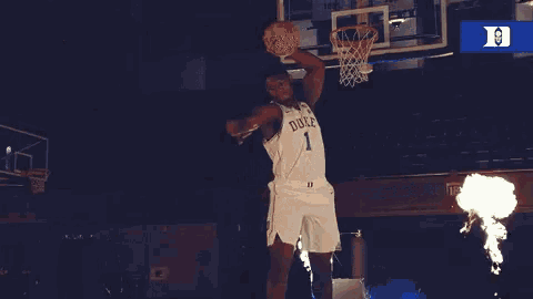 a duke basketball player is surrounded by fire