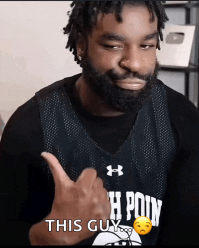 a man with a beard is wearing a h point jersey