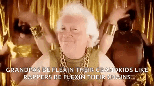 an elderly woman wearing a gold tank top and a gold chain around her neck is dancing .