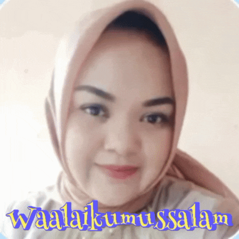 a woman wearing a hijab is smiling in front of a sign that says waalaikumsalam