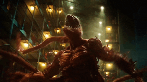 a red monster is standing in a dark room