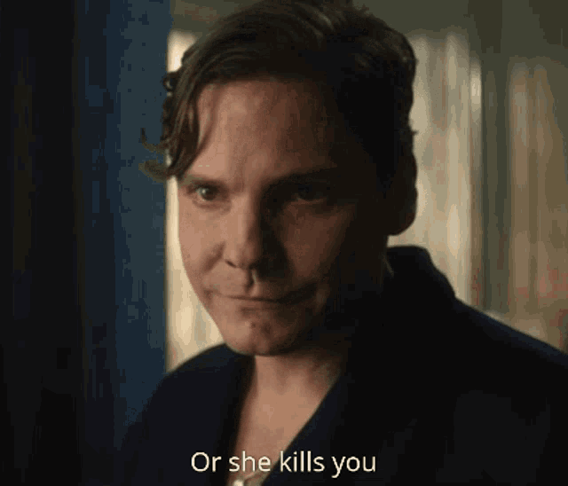a man says " or she kills you " in front of a window