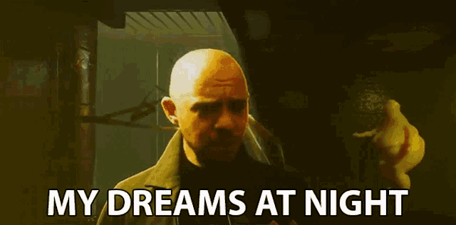 a man in a dark room with the words my dreams at night