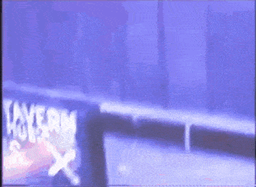 a blurry picture of a sign that says tavern on it