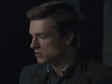 a blurry picture of a man 's face with a smokey background