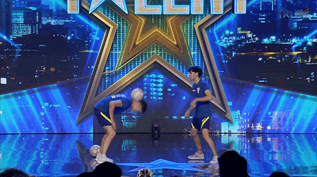two soccer players on a stage in front of a sign that says " talent "