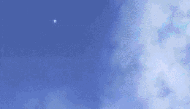 a cartoon character with wings is flying through the air