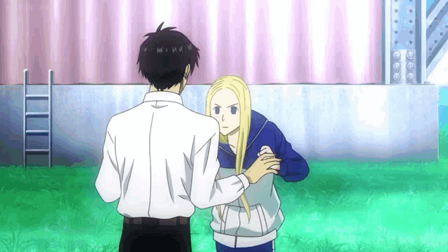 a man and a woman standing next to each other