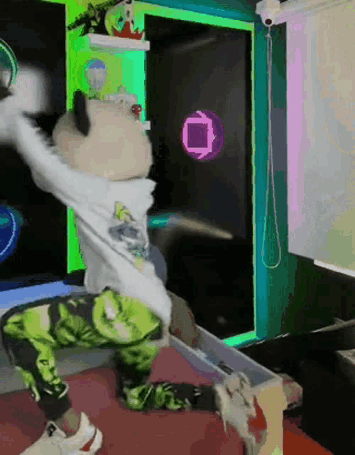 a person wearing green pants and a white shirt with a square on the back