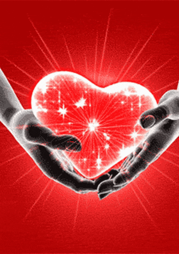 a pair of hands holding a glowing red heart on a red background