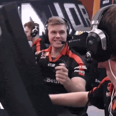 a man wearing headphones and a shirt that says beta